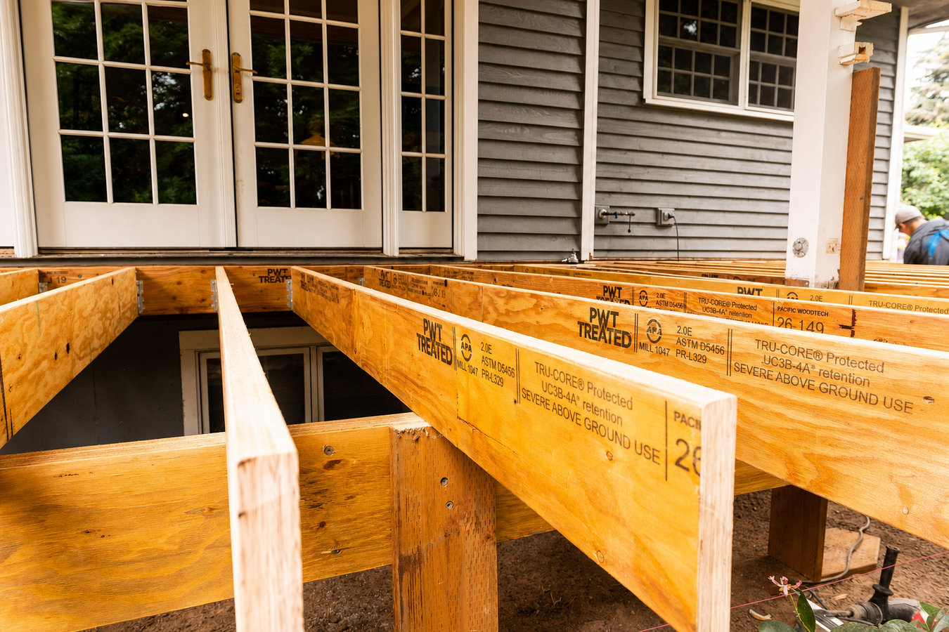 Pressure-treated wood deck construction